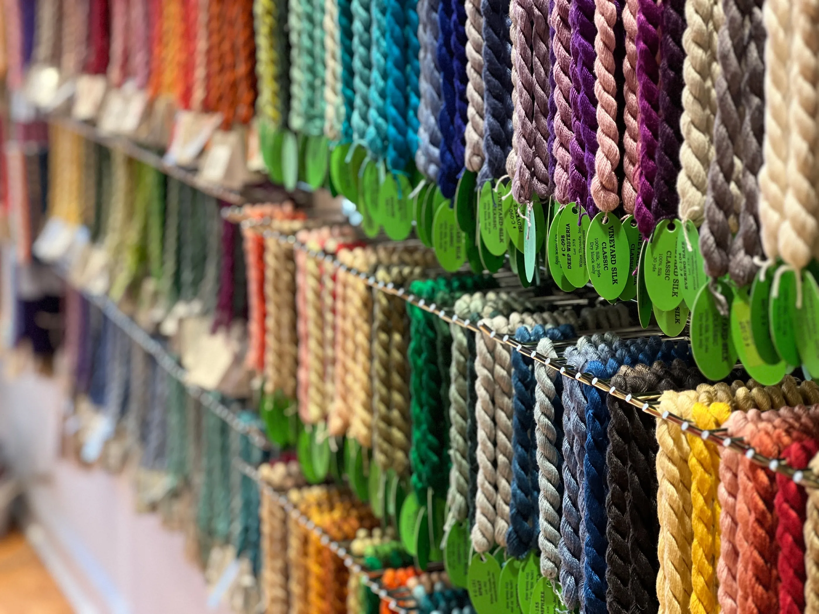 The thread wall at Stitch by Stitch.